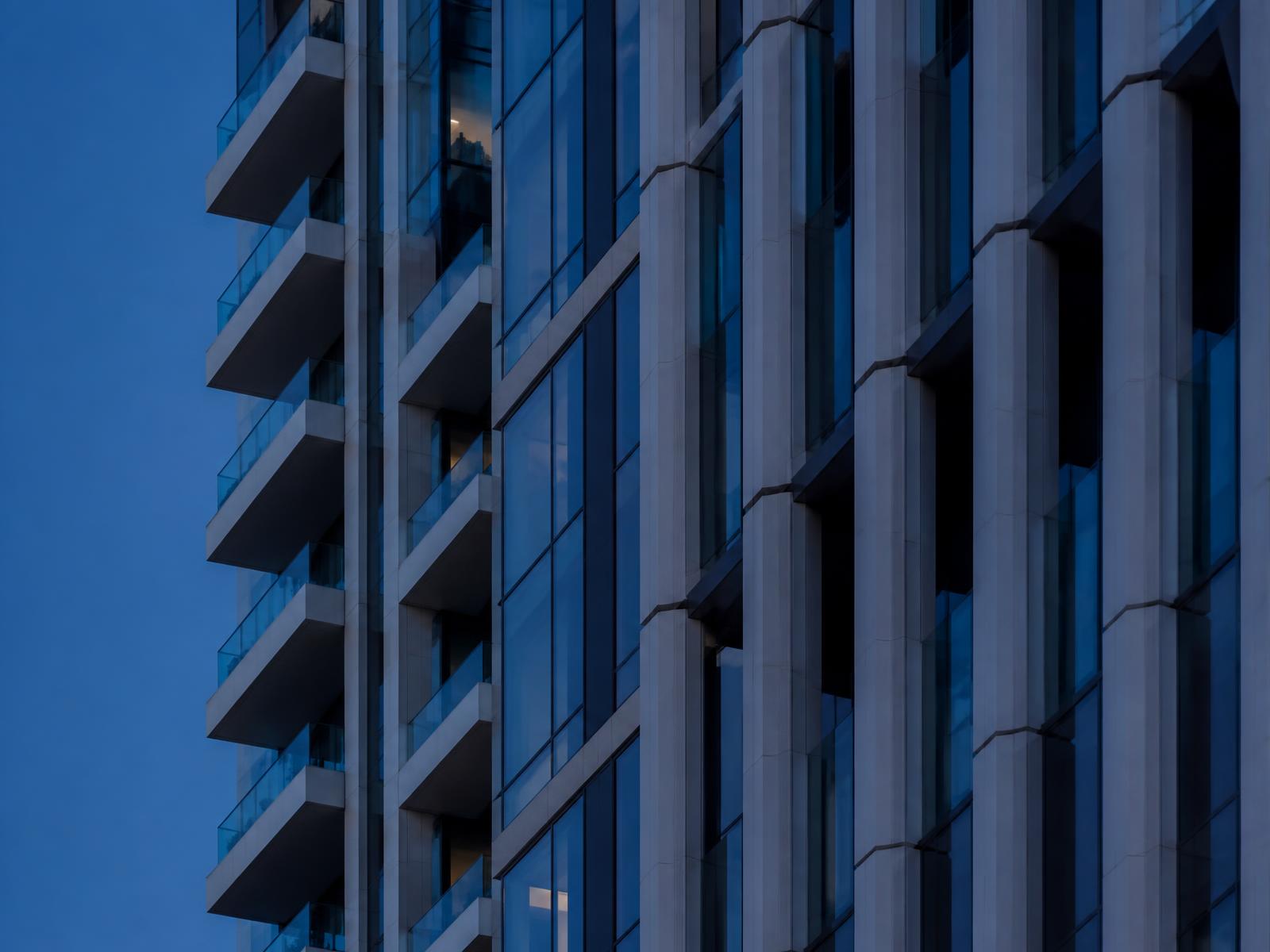 Architectural fins on a Dubai tower in soft blue light